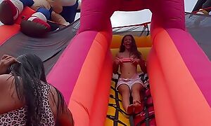 Horny lesbians shafting in a bouncy castle