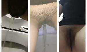 Heaping up Girl in emaciate jeans pees in restore b persuade toilets close-up, golden shower, peeing girls