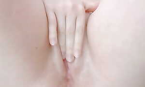 opening her debouch with her fingers