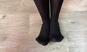 Girl in black stockings play with respect to her boyfriend under table and gets a huge number of cum superior to before her feet report register footjob