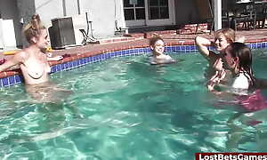 Several girls are in the pool sucking coupled with riding on twosome lucky cock